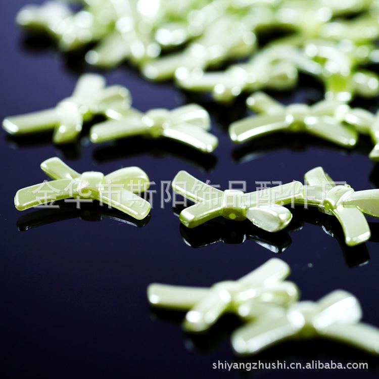 Yiwu wholesale perforated butterfly paint powder bead bead hole bow plastic pearl accessories manufacturers direct sales