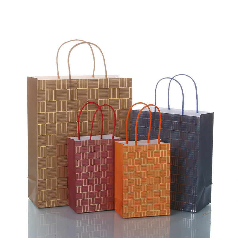 Environmental protection 150g white kraft paper gift bag foreign trade bronzing kraft paper bag general clothing packaging handbag customization thumbnail