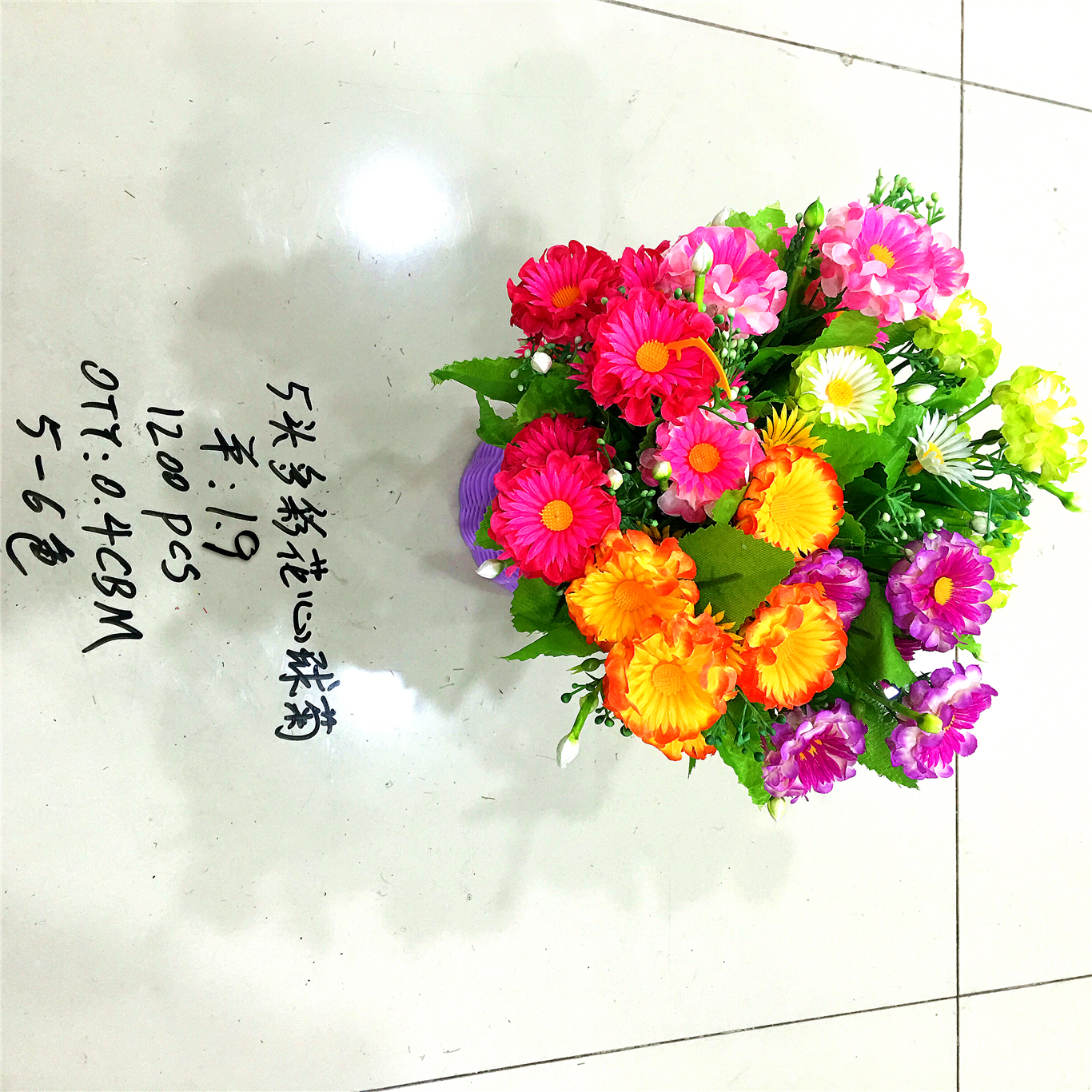 Five artificial flowers of multicolored flower centers full figure