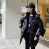 A new design of white duck down jacket for women, with a unique and mature look, and a loose, large-sized red glossy coat Application Scenario