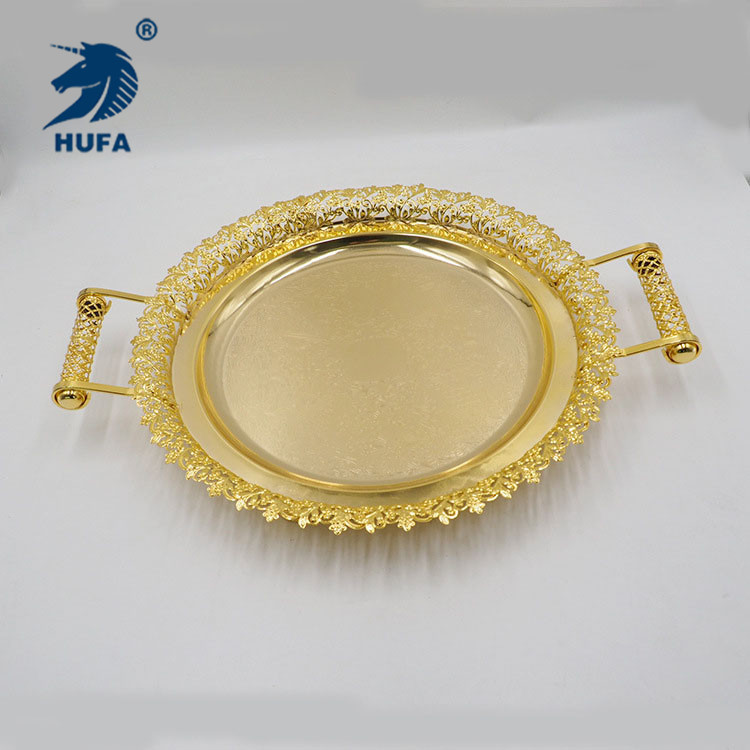 The new design features a circular golden metal tray for cups, teapots, storage trays, tableware and restaurant trays details Picture
