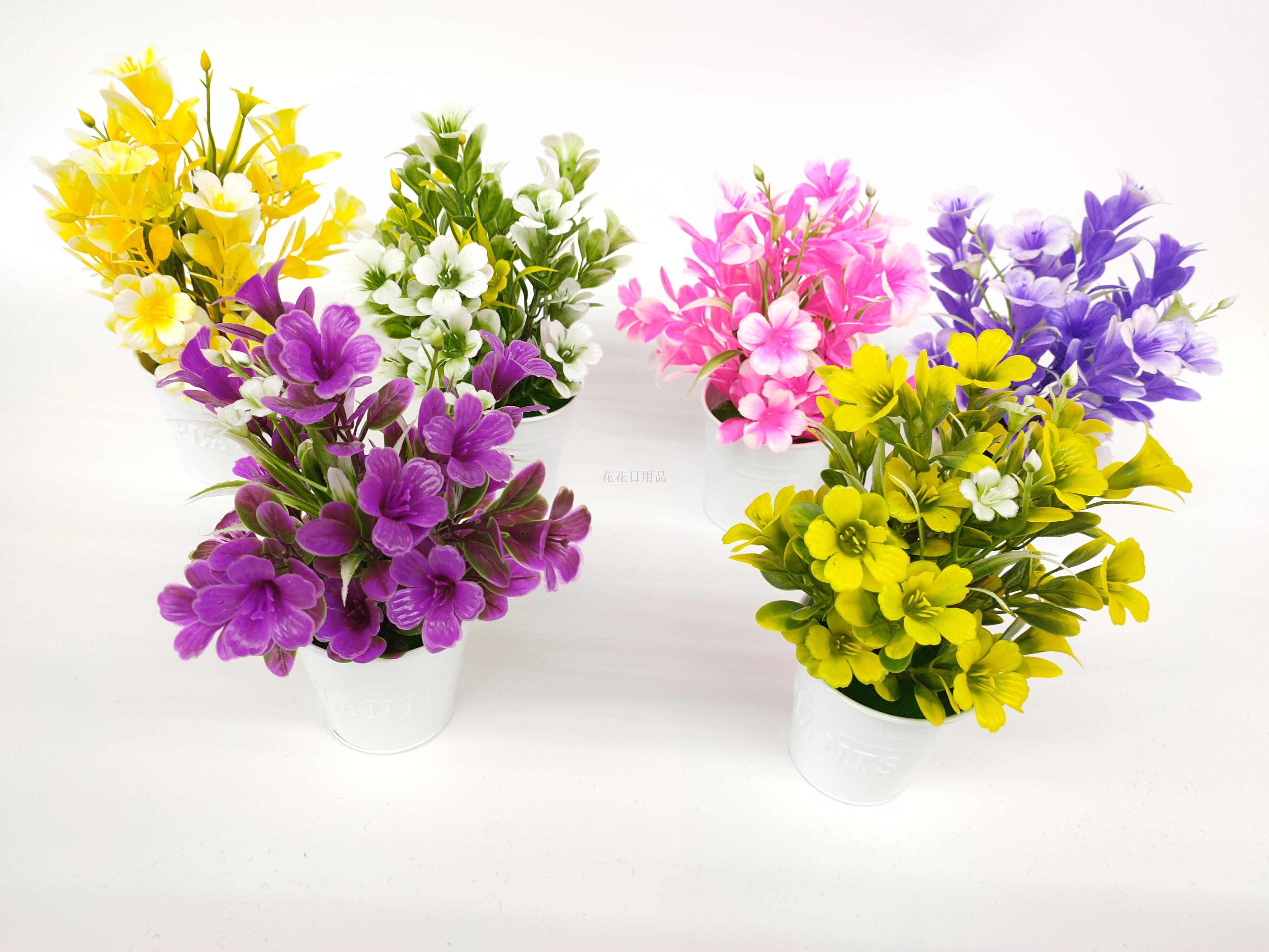 Fake flowers decorate the living room with small fresh bouquets of plastic flowers potted tea table