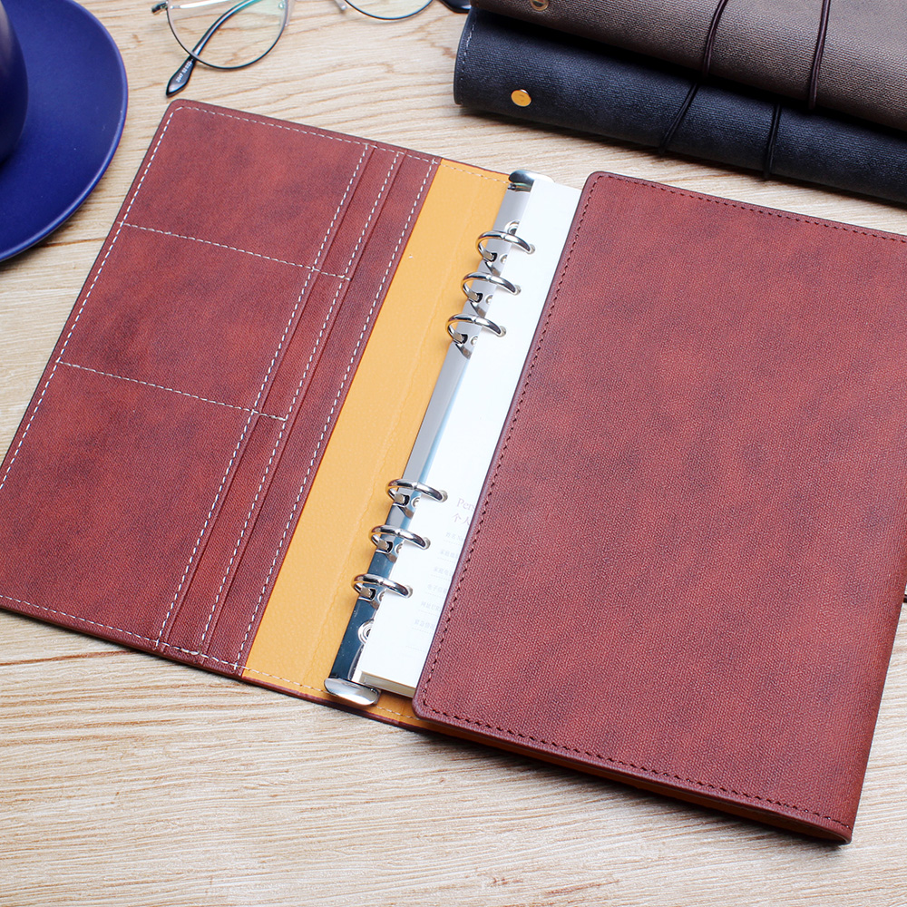 Factory wholesale of creative color-changing leather six-hole three-fold loose-leaf notebooks A5 business loose-leaf notebooks with customized logos Item Picture