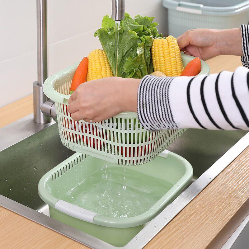 A rectangular double-layer draining vegetable basket with clips