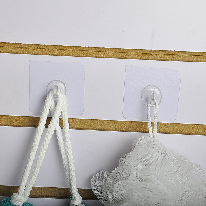 The transparent plastic hook leaves no trace behind the door, and the adhesive hook is pasted on the kitchen wall. It is a powerful nail-free magic hook with ox horn stickers Specification image