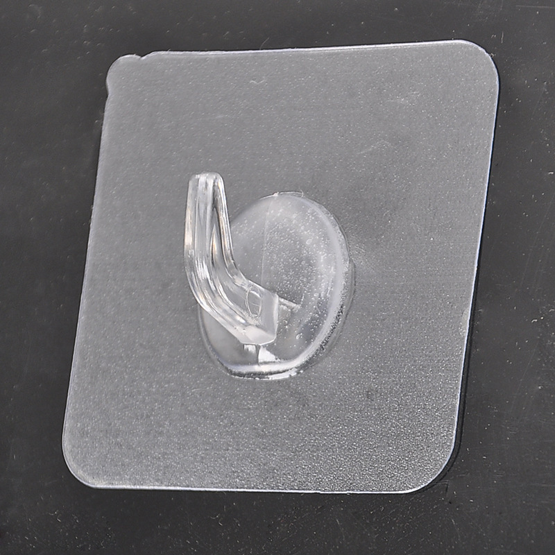 The transparent plastic hook leaves no trace behind the door, and the adhesive hook is pasted on the kitchen wall. It is a powerful nail-free magic hook with ox horn stickers details Picture