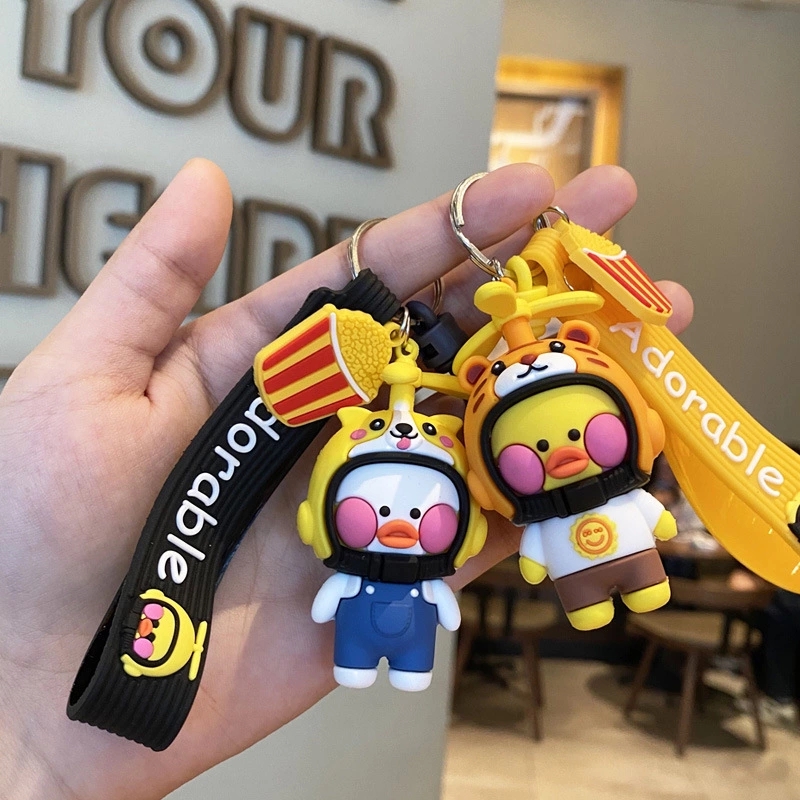 New best-selling helmet, duck keychain, creative and cute schoolbag pendant, couple car keychain ring gift details Picture