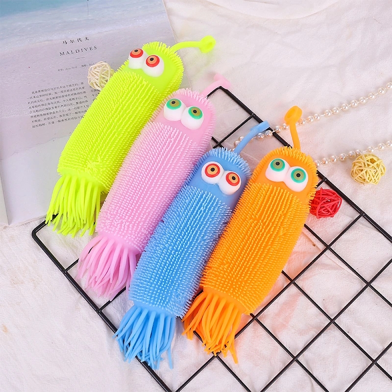 Night market, glittering street stalls, wholesale of children's toys, octopus with protruding eyes, caterpillar electronic cartoon, venting, fluffy ball h Item Picture