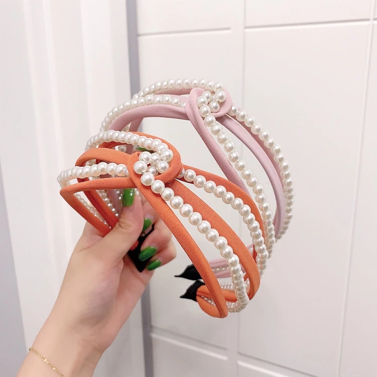 Korean candy-colored pearl beaded fabric hairband with a cross hook in the middle, wide edge lantern pressing hair accessory for women Application Scenario