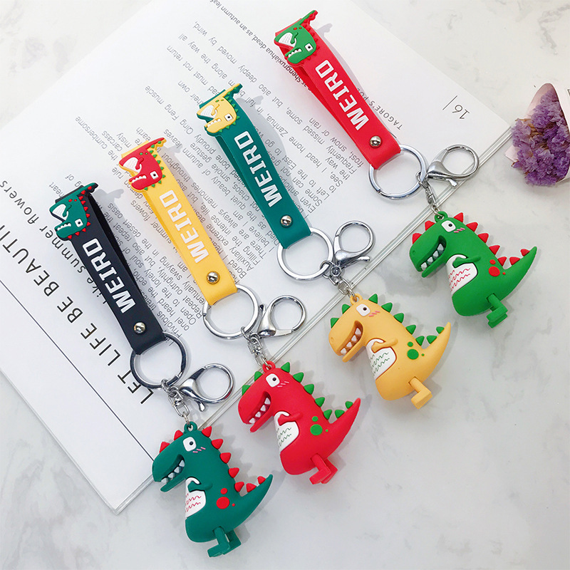Wholesale of trendy new silicone dinosaur keychains, cute female cartoon figurines, couple key chains, bags, pendants and gifts details Picture