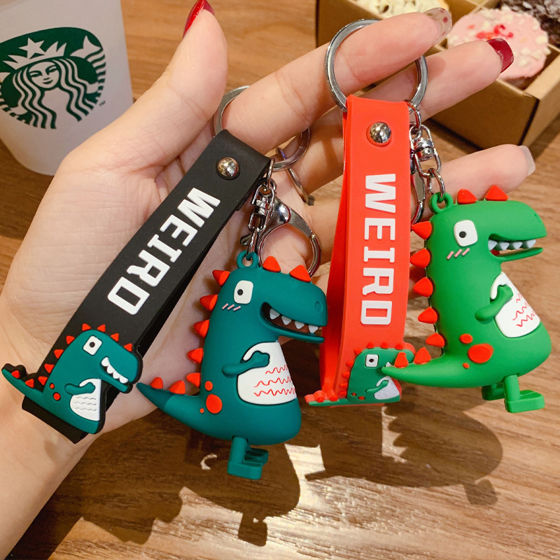 Wholesale of trendy new silicone dinosaur keychains, cute female cartoon figurines, couple key chains, bags, pendants and gifts