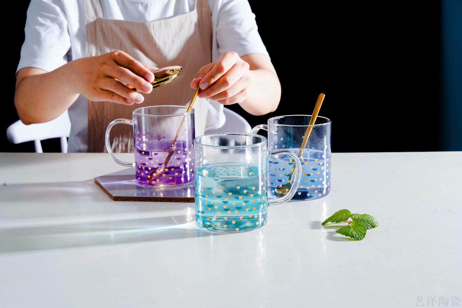 Sparkling glass with gold lid and stylish mugs