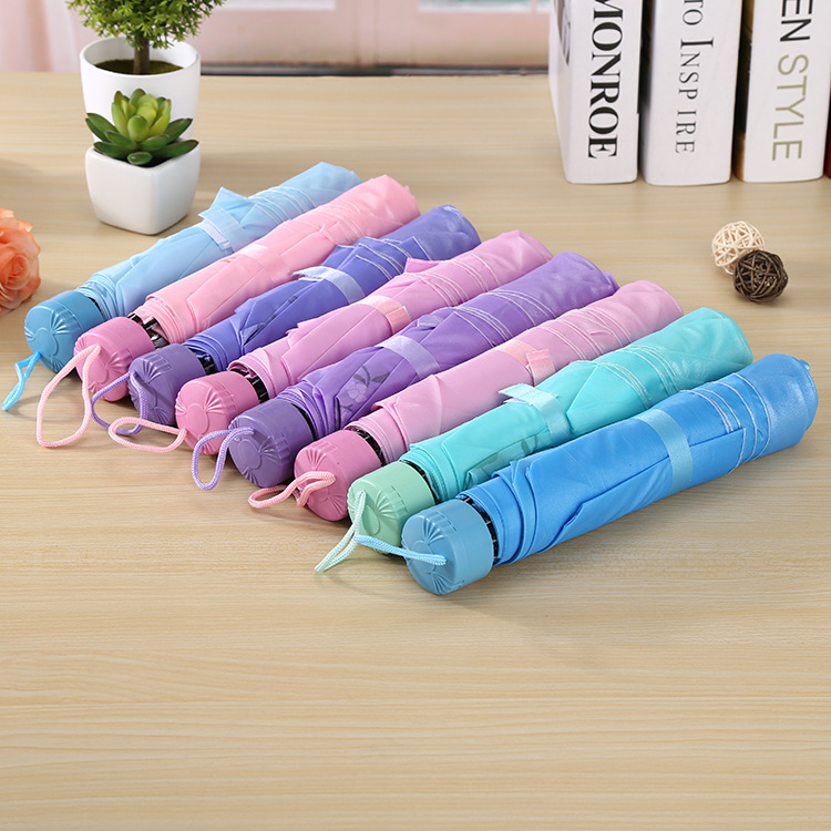 Wholesale of three-fold umbrellas, creative candy-colored inverted pole pearlescent umbrellas, manual couple style, short-handled, all-weather and all-weather advertising umbrellas