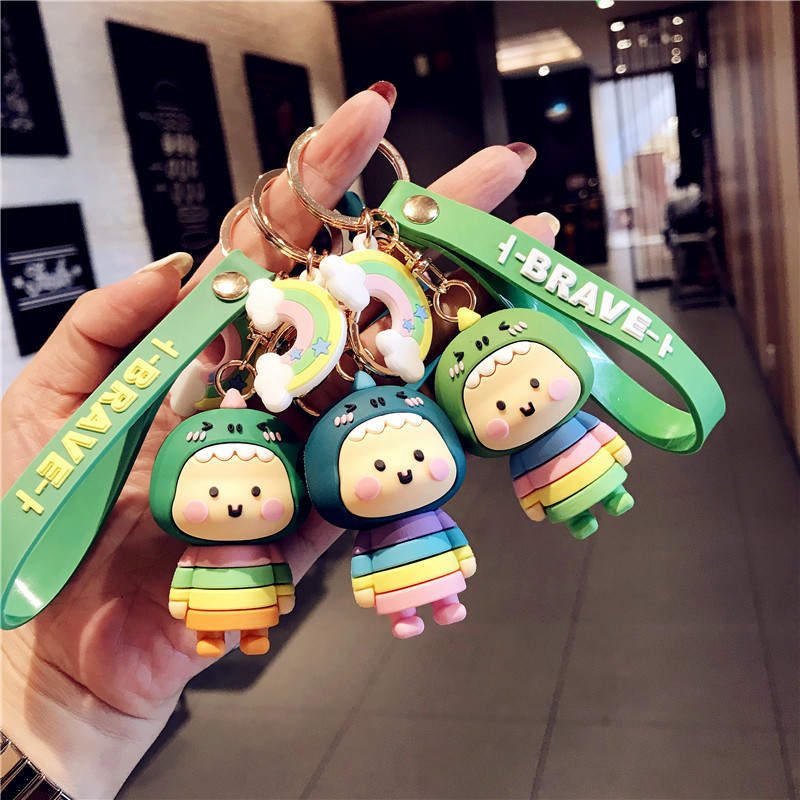 Wholesale trend of cartoon dinosaur sister dolls, car keychains, Korean female creative schoolbags, keys, small pendants and gifts