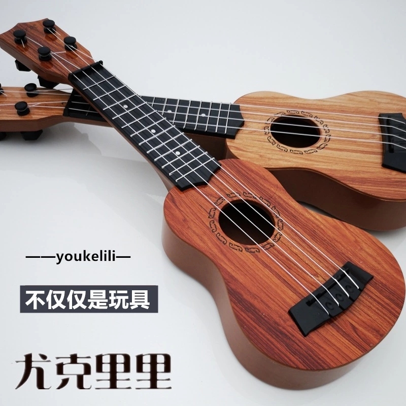 The children's small guitar is a toy that can play a medium-sized ukulele, a beginner's instrument, and comes with a pick for music full figure