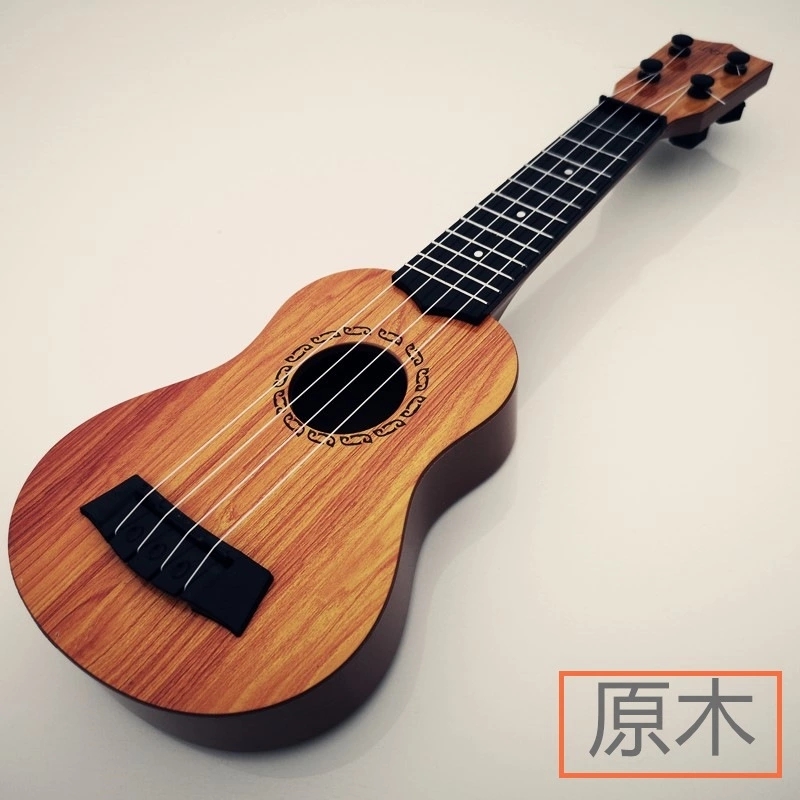 The children's small guitar is a toy that can play a medium-sized ukulele, a beginner's instrument, and comes with a pick for music Application Scenario