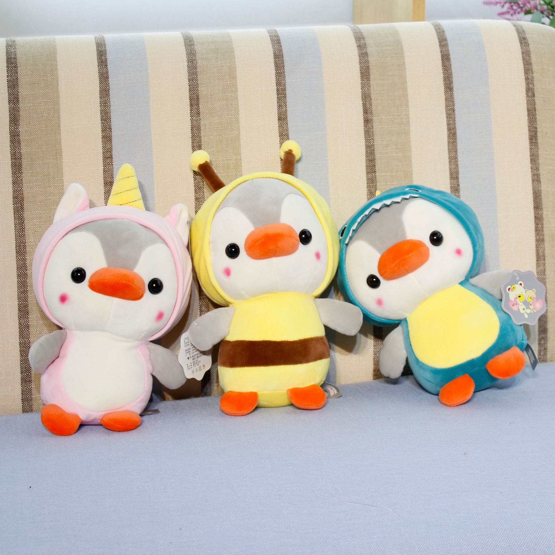 New best-selling, super cute and adorable penguin transformation plush toy figurines, claw machine dolls, children's toy gifts details Picture