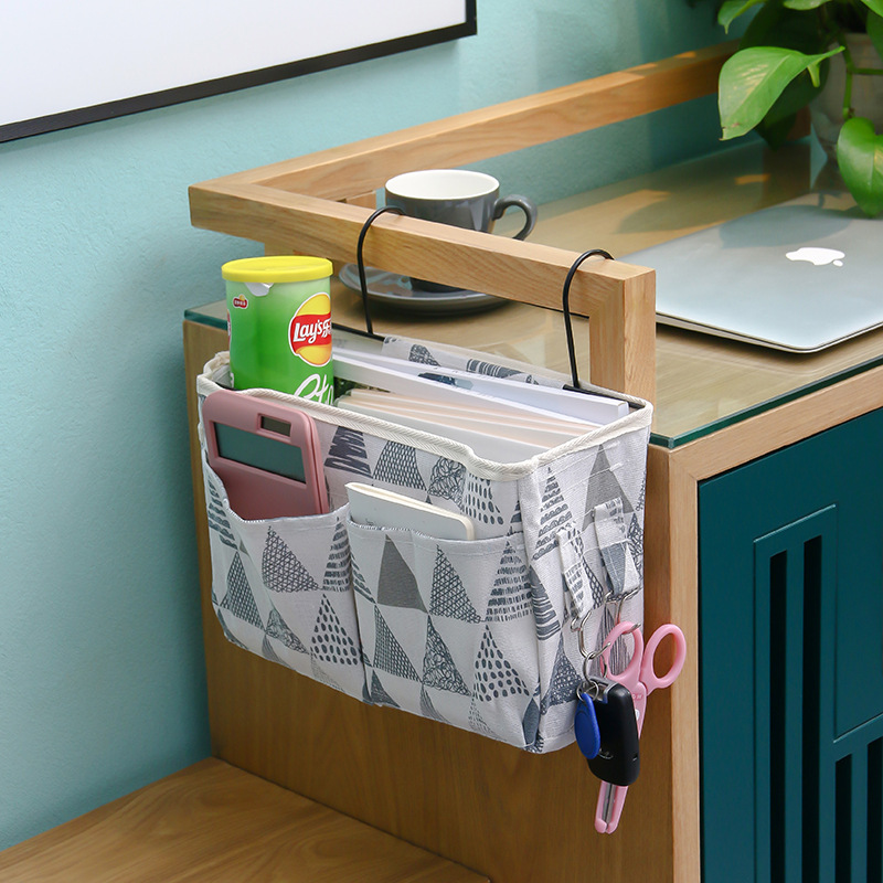 Multi-functional bedside hanging bag for home use, fabric hanging basket beside the bed in college dormitories, and a bag for organizing and storing miscellaneous items on the bed