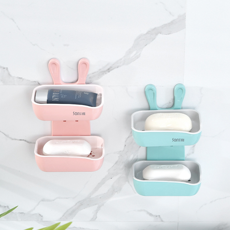 The fashionable and creative "Little White Rabbit" double-layer soap box is simple and convenient. It doesn't require drilling and leaves no marks. It can be used as a home bathroom soap box