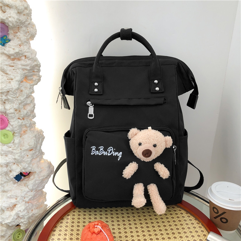 The production of a cute and playful schoolgirl backpack with a cute doll bear and a large capacity of casual student backpacks Item Picture
