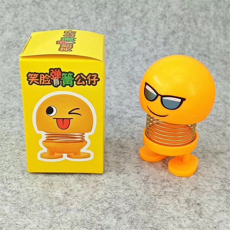 New smiling face spring dolls, little yellow emoticons, shaking head dolls, novel and unique car car ornaments, doll toys full figure