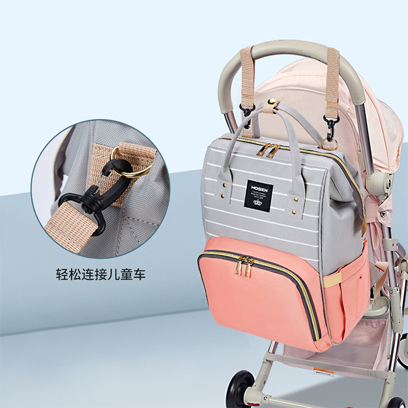 The 2021 new simple and fashionable striped mother and baby backpack can be hung on a stroller, a multi-functional mom bag, and a large-capacity maternity bag Specification image