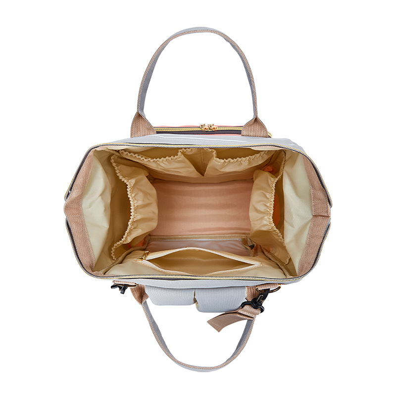 The 2021 new simple and fashionable striped mother and baby backpack can be hung on a stroller, a multi-functional mom bag, and a large-capacity maternity bag Application Scenario