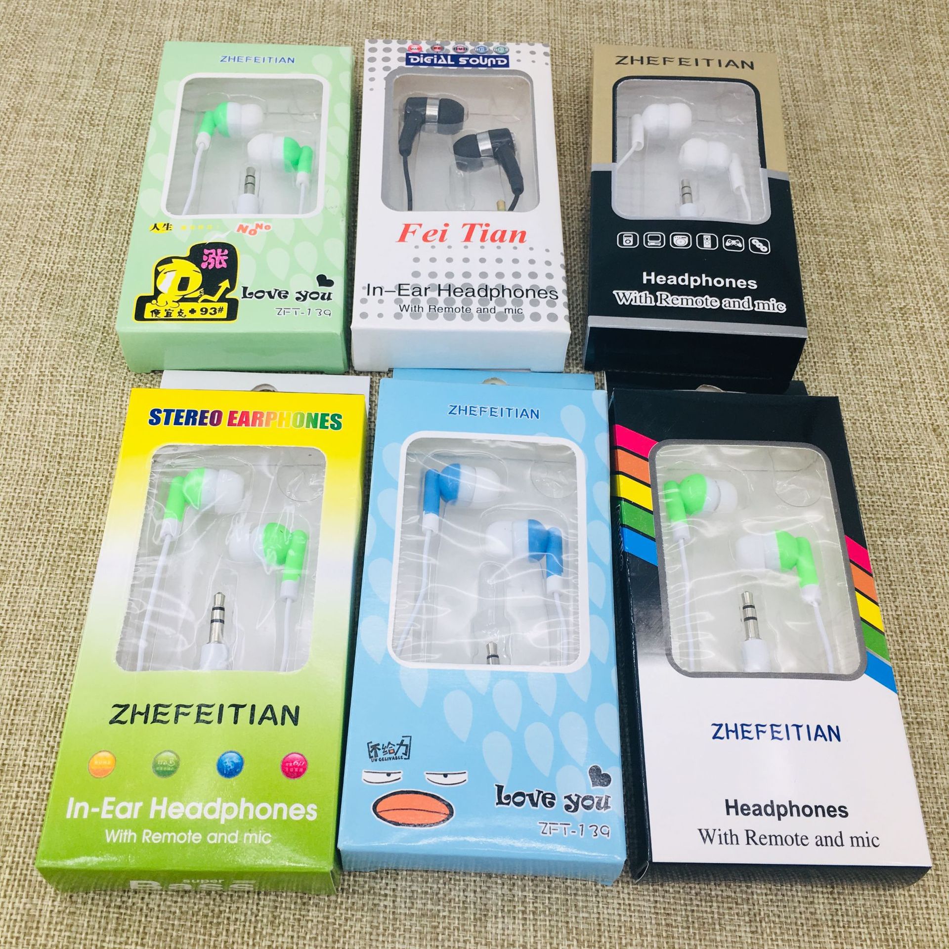 Direct sales of mobile phone headphones from the manufacturer, candy-colored in-ear MP3 headphones in paper boxes, wholesale of computer accessories, two-yuan store