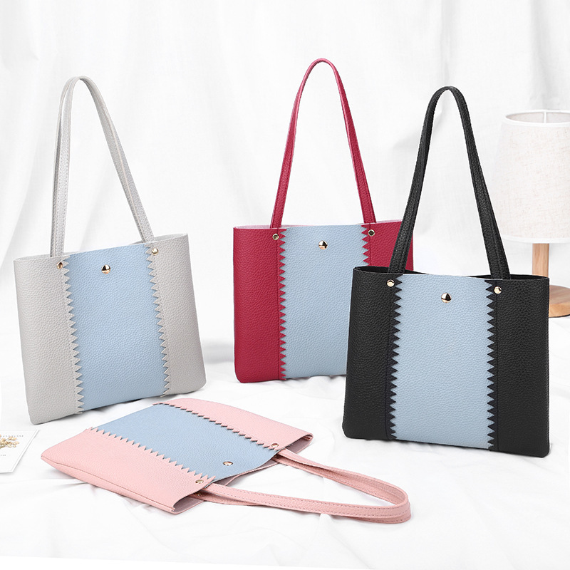 Women's bag 2021 New style lychee pattern contrasting color handbag, bucket bag, fashionable casual simple shopping bag, gift bag