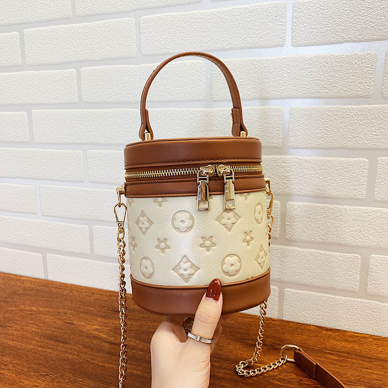 2021 Spring New trendy Korean-style cylindrical women's bag, single-shoulder bag, popular mini hand-held small bag, embossed women's bag details Picture