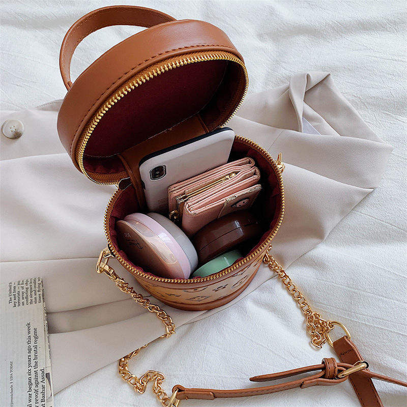 2021 Spring New trendy Korean-style cylindrical women's bag, single-shoulder bag, popular mini hand-held small bag, embossed women's bag Application Scenario