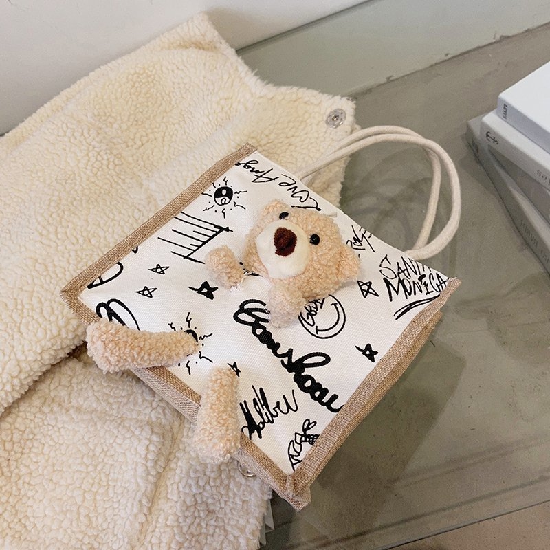 2021 New trendy Korean version Instagram printed cow graffiti bear canvas bag for women, cute and adorable single-shoulder bag details Picture