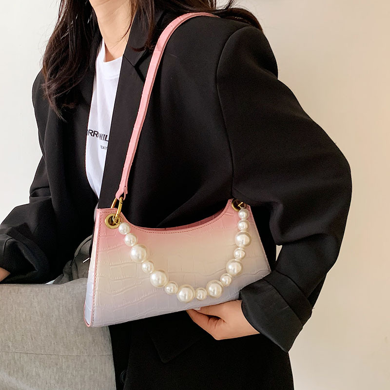 The popular pearl hand-held small bag 2021 spring Korean version, new stone pattern, unique and versatile, single-shoulder armpit bag, PU