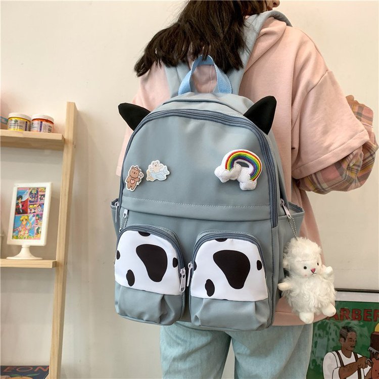 Japanese-style ins campus school style, fresh and cute, cute cow with earbuds, soft girl schoolbag, funny student backpack details Picture