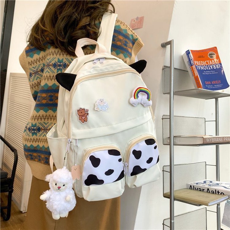 Japanese-style ins campus school style, fresh and cute, cute cow with earbuds, soft girl schoolbag, funny student backpack Specification image