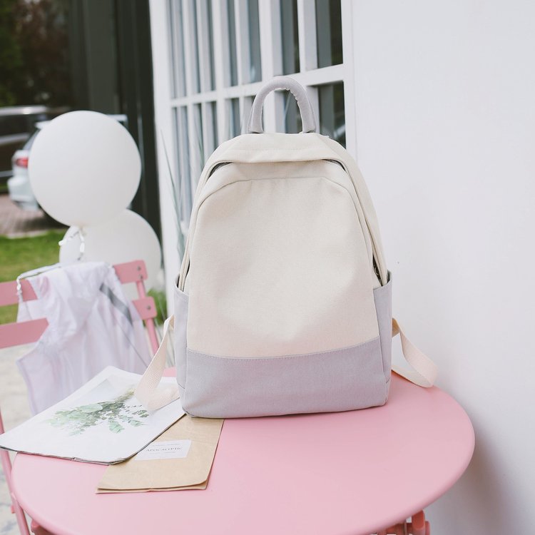 Factory wholesale of college-style, fresh, artistic, simple and versatile canvas backpacks, color-matched schoolbags for middle school best friends Application Scenario