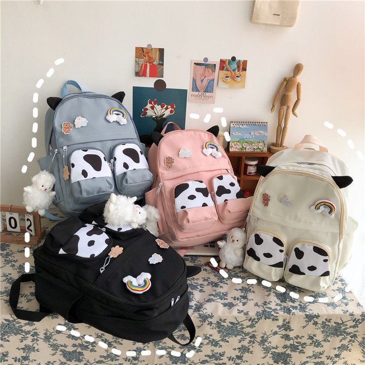 Japanese-style ins campus school style, fresh and cute, cute cow with earbuds, soft girl schoolbag, funny student backpack Application Scenario