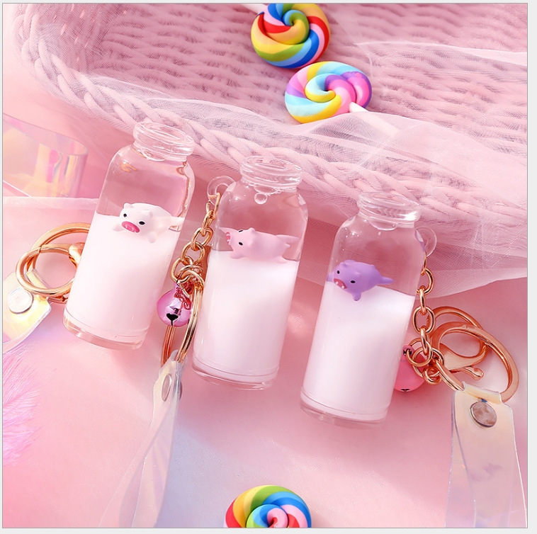 New milk pig bottle oil keychain floating pig sand pendant glass bottle surfing pig bag pendant details Picture
