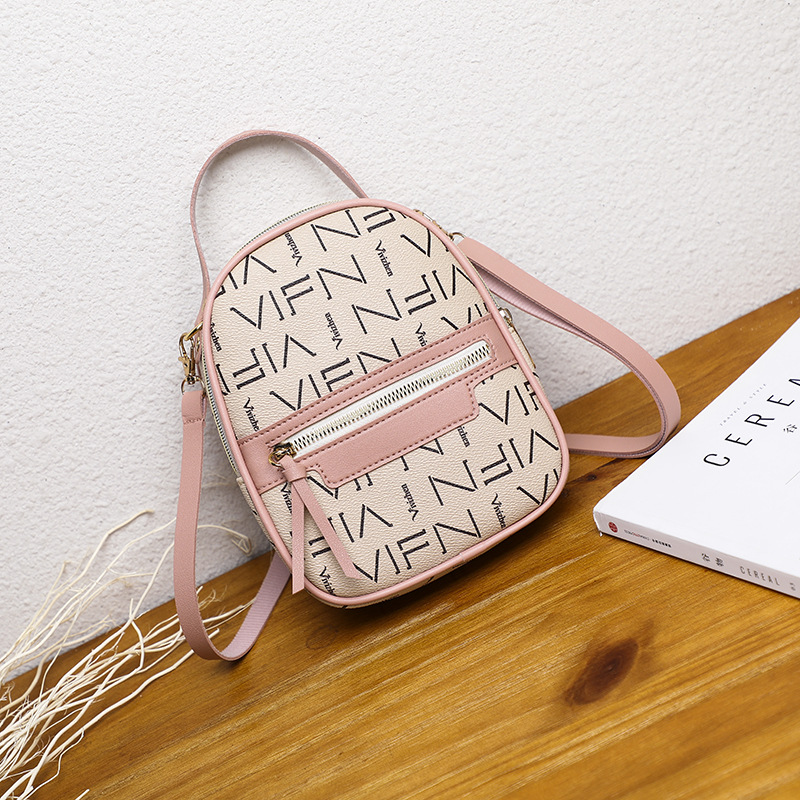 A woman's single shoulder color bump small backpack 2019 autumn/winter Korean edition new crossbody printing student coin wallet