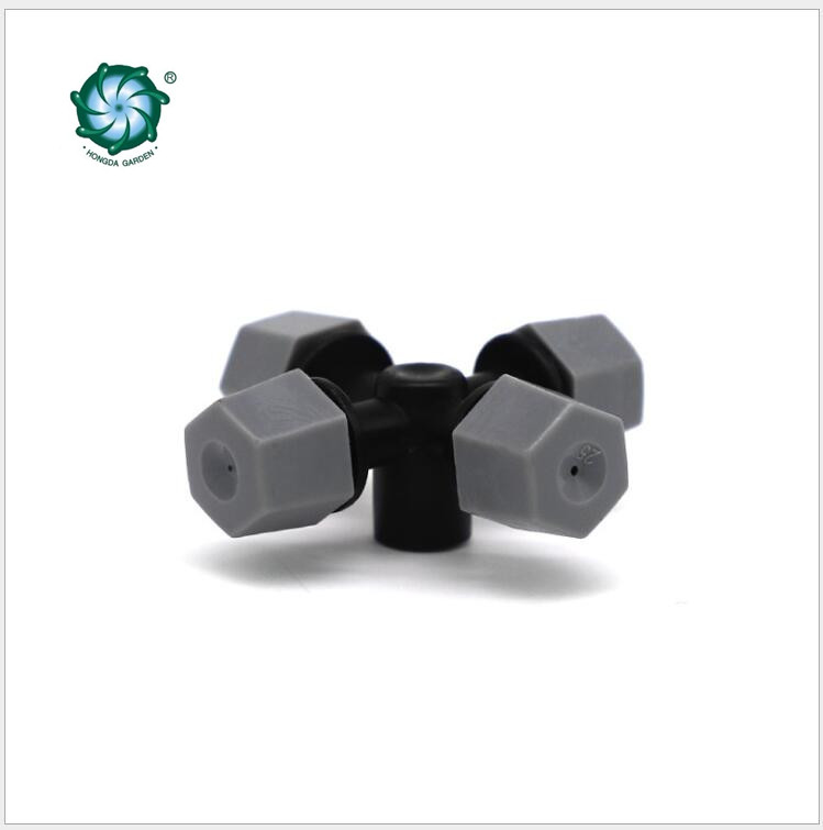 The grey cross-shaped atomizing micro-sprinkler heads are used for cooling and humidifying the roof of the four-outlet greenhouse seedling raising farm Item Picture