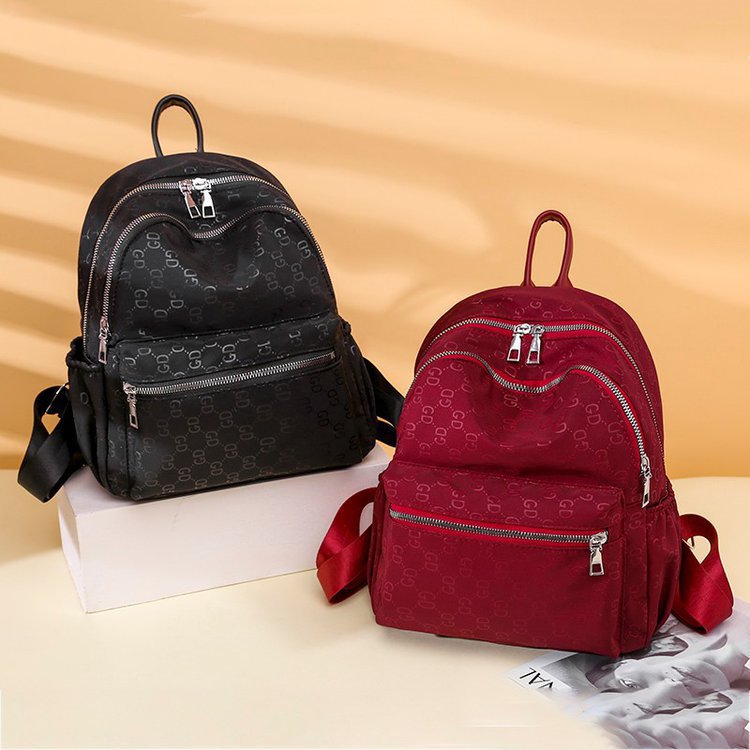 2021 spring new fashion double back female fashion schoolbag Female soft leather commuter backpack female female bag is very fashionable