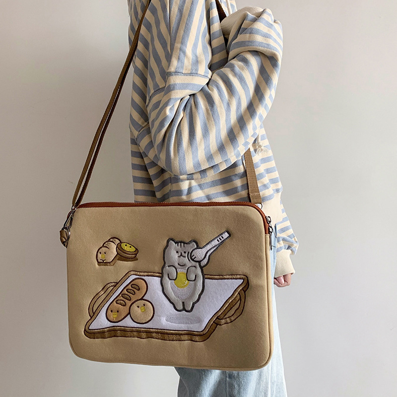 A cute 2021 new computer bag with a Japanese and Korean ins style, featuring an 11-inch tablet ipad inner liner and anti-bending storage protection bag details Picture