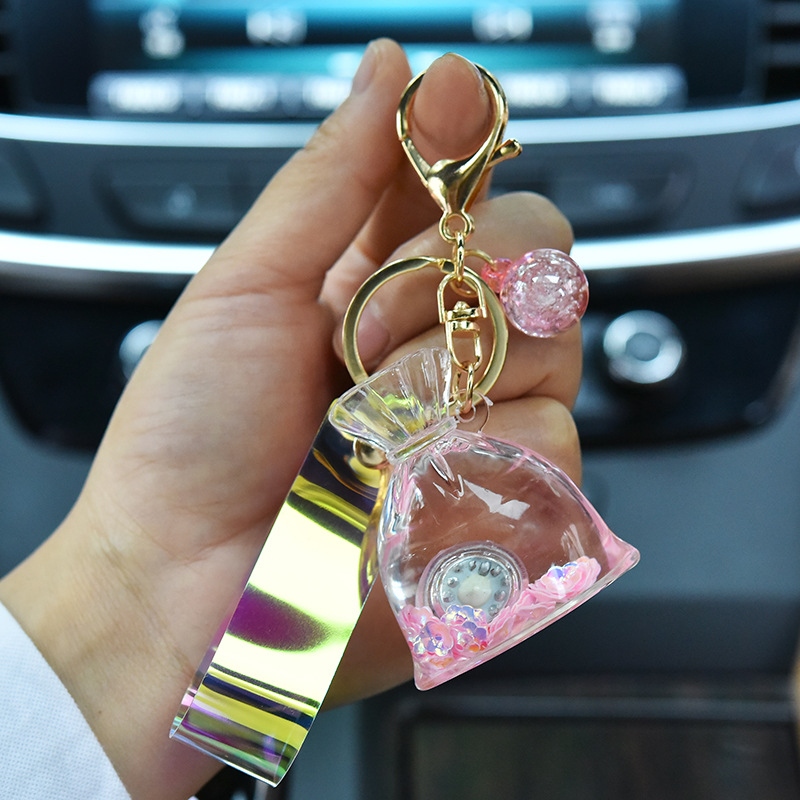 Creative acrylic cartoon flowing sand with light, lucky bag keychain, glowing oil, money bag pendant, claw machine hanging decoration Specification drawing
