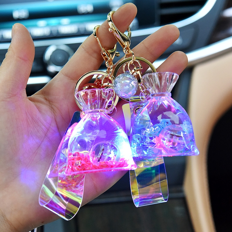 Creative acrylic cartoon flowing sand with light, lucky bag keychain, glowing oil, money bag pendant, claw machine hanging decoration full figure
