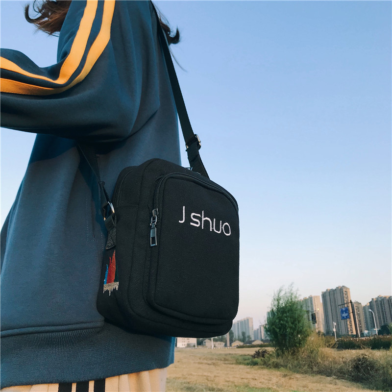 Wholesale of new canvas bags, simple lettered student single-shoulder crossbody bags, cool hip-hop mobile phone small square bags for girls details Picture