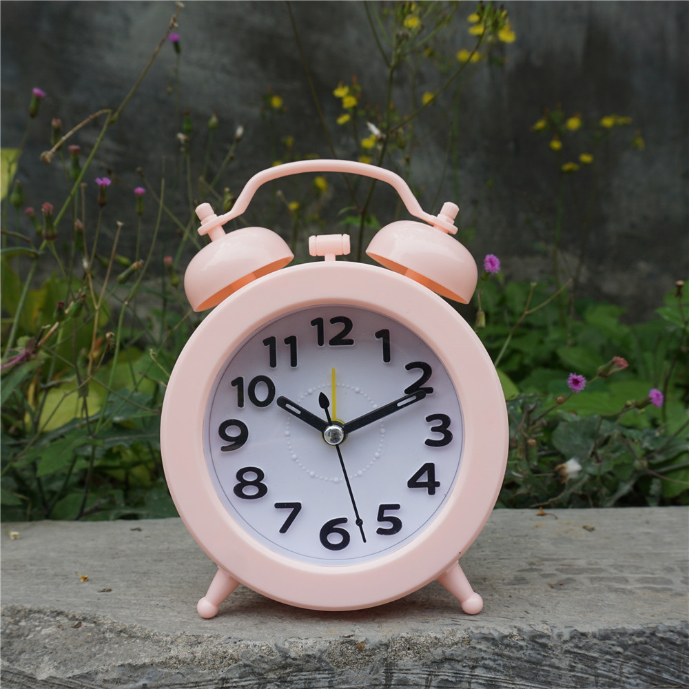 Candy-colored spherical double-bell alarm clock, fashionable clock, three-dimensional digital table clock, fashionable and modern lazy person clock Application Scenario