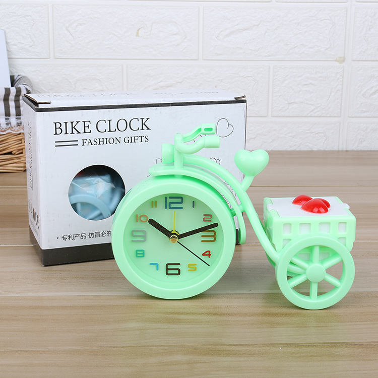 A new candy-colored tricycle alarm clock with a trunk for candies, a creative student dormitory desk and bedside alarm clock Application Scenario