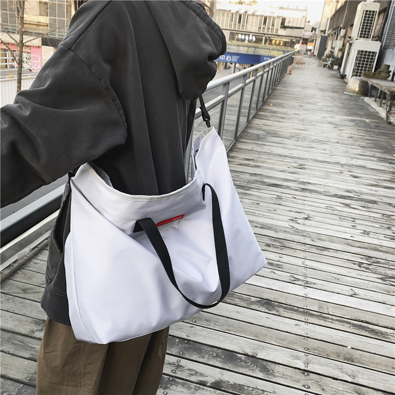 Short trip bag Male Korean version light handbag Female business trip large capacity single shoulder crossbody sports fitness bag