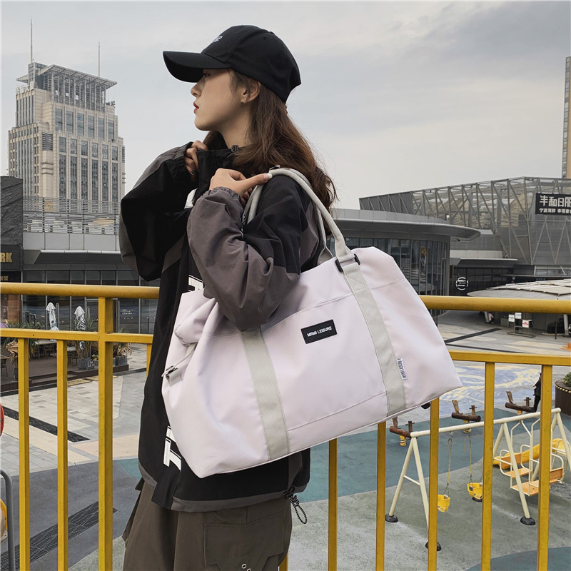 Sports bag Short trip bag Women's tote Large capacity travel portable duffle bag Boarding gym bag Men's