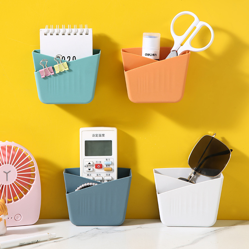 Storage box, non-perforated desktop, creative wall-mounted plastic air conditioner remote control, bedside mobile phone storage rack